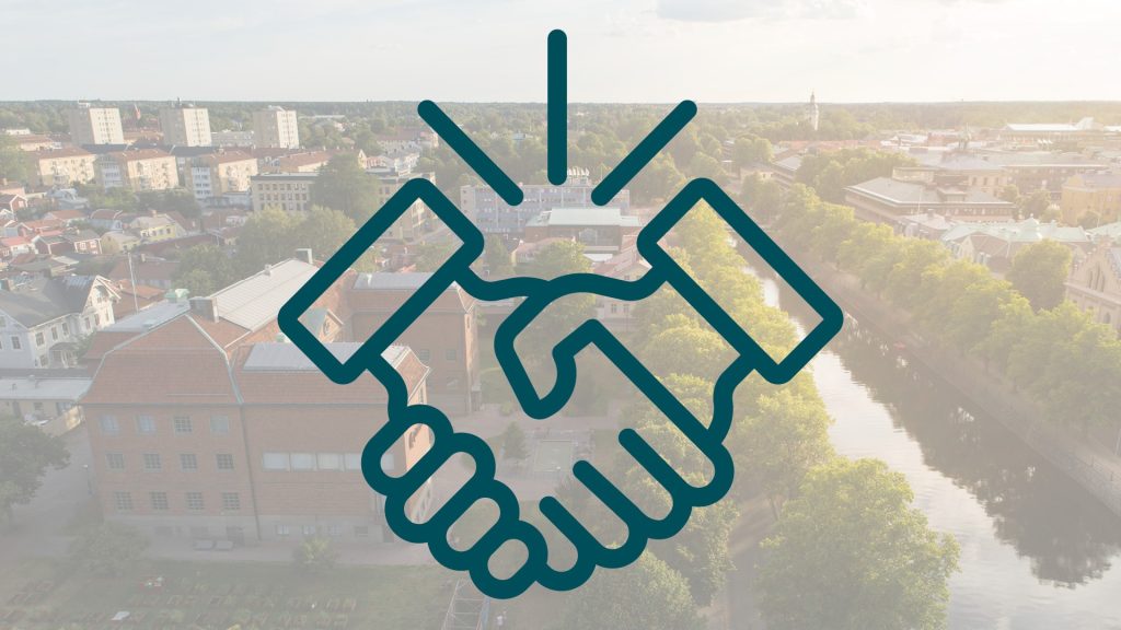 Illustration av ett handslag på en bakgrund av en flygbild över Gävle